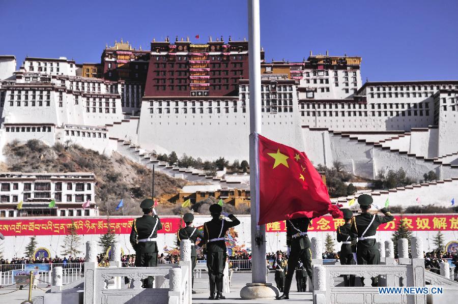 A flag-raising ceremony is held to celebrate the 55th anniversary of serfs&apos; emancipation in Lhasa, capital of southwest China&apos;s Tibet Autonomous Region, March 28, 2014