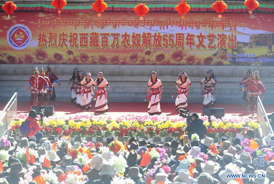 Dancers of a folk art troupe from Shannan Prefecture of Tibet Autonomous Region perform during a variety show to celebrate the 55th anniversary of serfs&apos; emancipation, in Lhasa, capital of the region in southwest China, March 28, 2014.