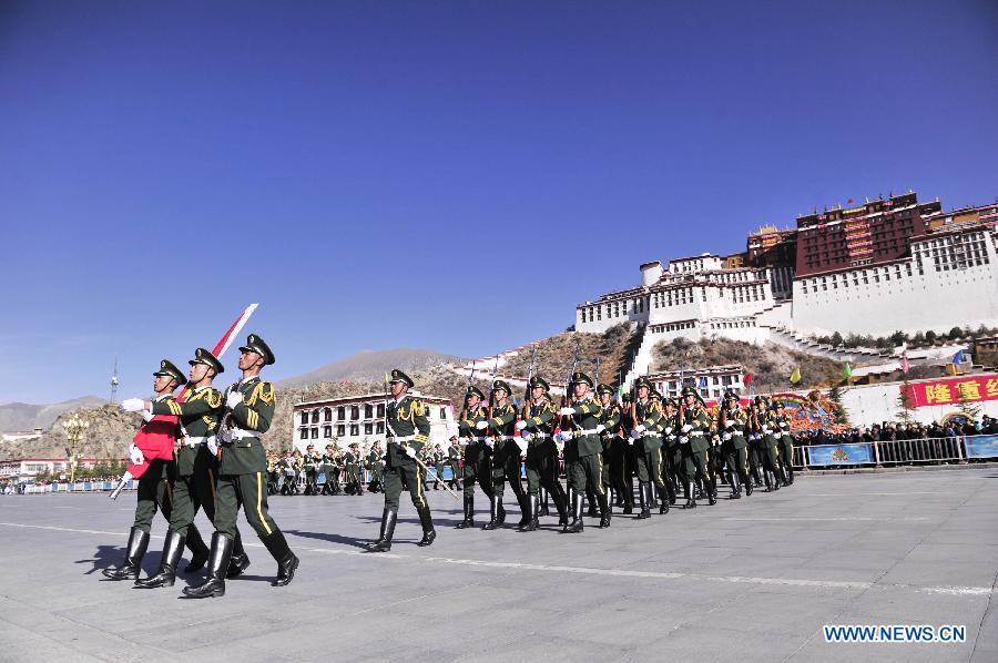 A flag-raising ceremony is held to celebrate the 55th anniversary of serfs&apos; emancipation in Lhasa, capital of southwest China&apos;s Tibet Autonomous Region, March 28, 2014.