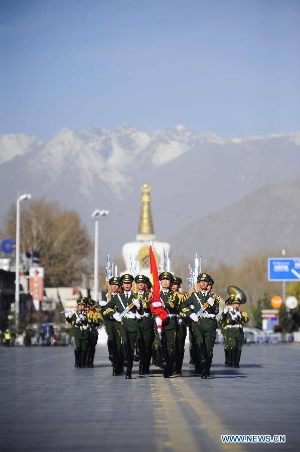 A flag-raising ceremony is held to celebrate the 55th anniversary of serfs&apos; emancipation in Lhasa, capital of southwest China&apos;s Tibet Autonomous Region, March 28, 2014