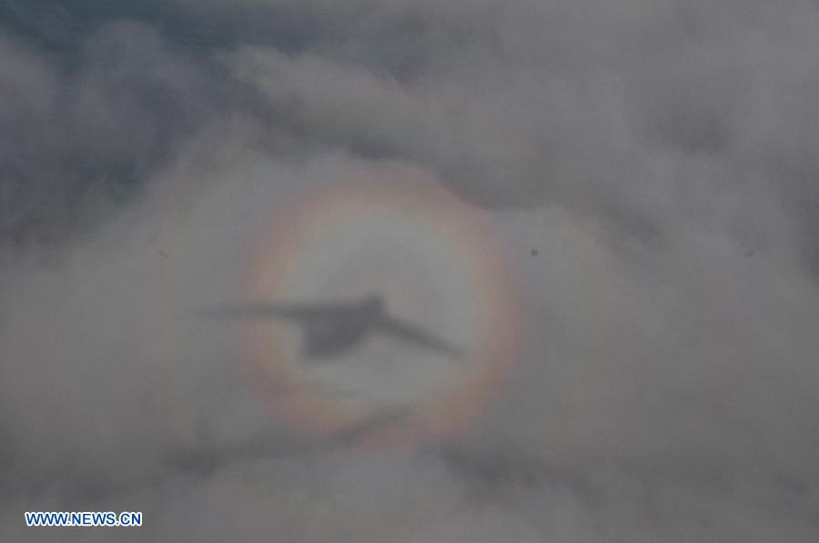 Chinese Air Force IL-76 transport plane searches for Malaysia Airlines flight MH370 above the southern Indian Ocean, on March 28, 2014.