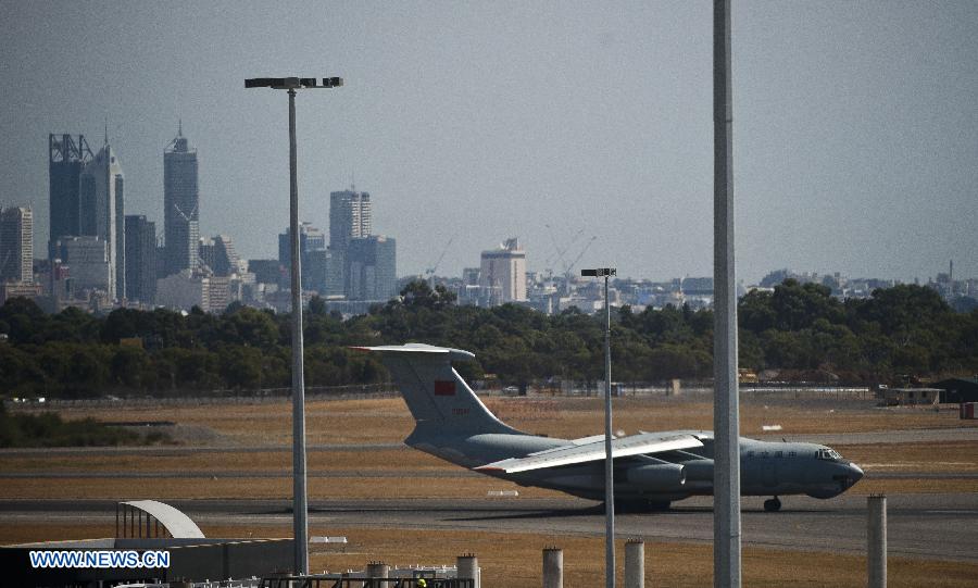 A Chinese Air Force plane returns to the International Airport of Perth in Australia, March 28, 2014. 