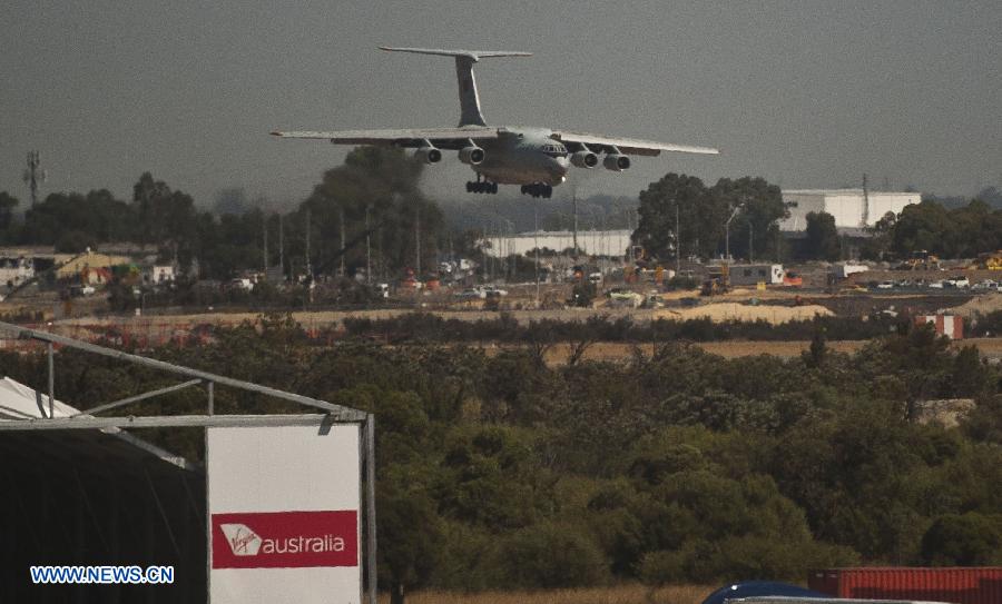 A Chinese Air Force plane returns to the International Airport of Perth in Australia, March 28, 2014. 