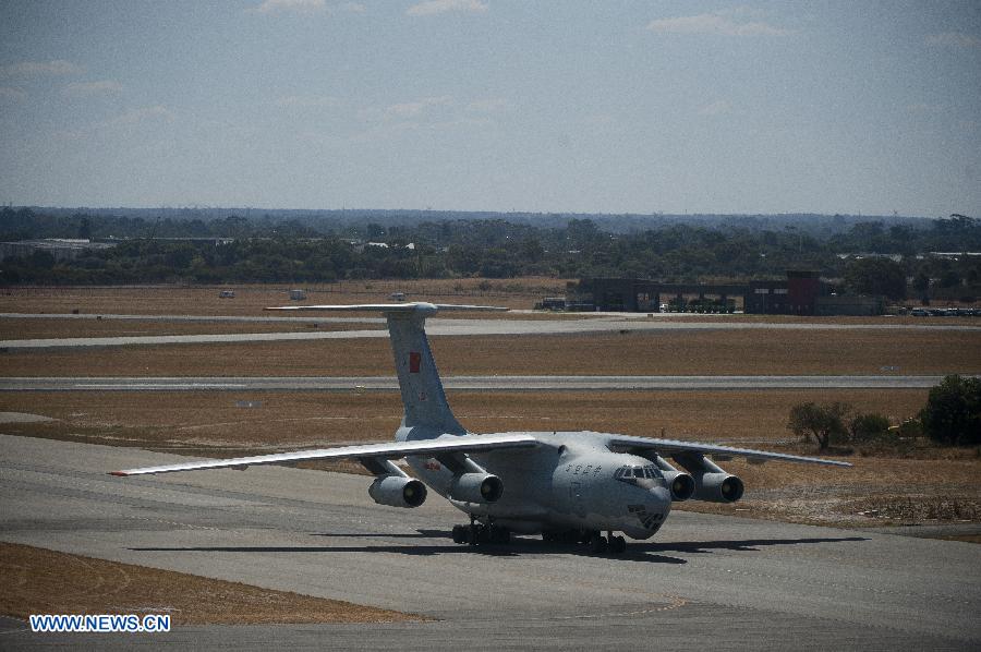 A Chinese Air Force plane returns to the International Airport of Perth in Australia, March 28, 2014. 