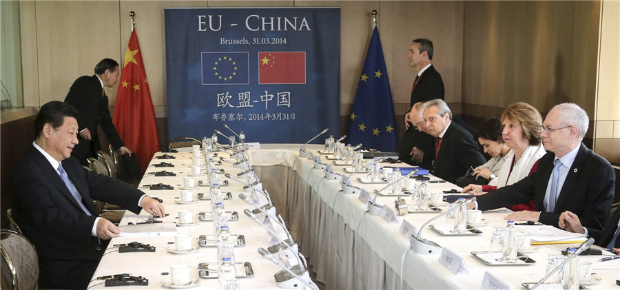 Chinese President Xi Jinping (L) attends a meeting with European Council President Herman Van Rompuy (R) and European Union foreign policy chief Catherine Ashton (2nd R) at the EU Council in Brussels March 31, 2014. [Photo/China Daily via agencies] 