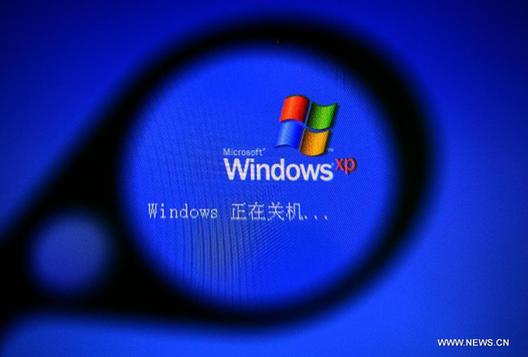Photo taken on April 7, 2014 shows the shutdown interface of Windows XP, in Shenyang, capital of northeast China's Liaoning Province. Microsoft announced earlier that it will stop providing technical assistance for Windows XP after April 8, and computers will still work but they might become more vulnerable to security risks and viruses. 