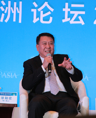 Xu Heyi, chairman of Beijing Automotive Group, speaks on the sidelines of the Boao Forum. [China.org.cn/He Shan]