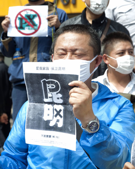 A man participates in a protest in Kunming, capital of Yunnan province, opposing construction of a chemical plant in May 2013. [Photo/China Daily]