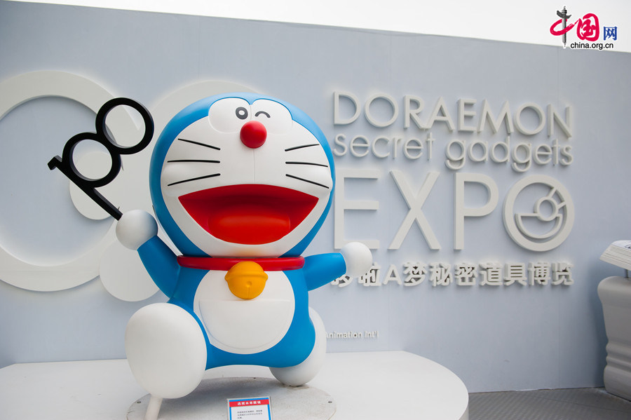 A '100 Doraemon Secret Gadgets Expo' is launched at Joycity Shopping Center in Beijing, on Saturday, April 19, 2014. The exhibition will last until June 22. A hundred life-size Doraemon figures, each of which bearing a distinct secret gadget, will be displayed during the show. Doraemon, a 22nd-century robotic cat, has been a popular anime character since its introduction by Japanese cartoonist Fujiko Fujio in 1969. [Photo by Chen Boyuan / China.org.cn]