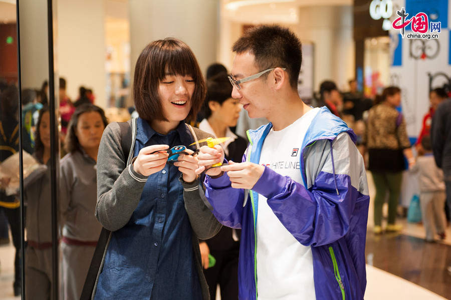 A &apos;100 Doraemon Secret Gadgets Expo&apos; is launched at Joycity Shopping Center in Beijing, on Saturday, April 19, 2014. The exhibition will last until June 22. A hundred life-size Doraemon figures, each of which bearing a distinct secret gadget, will be displayed during the show. Doraemon, a 22nd-century robotic cat, has been a popular anime character since its introduction by Japanese cartoonist Fujiko Fujio in 1969. [Photo by Chen Boyuan / China.org.cn]