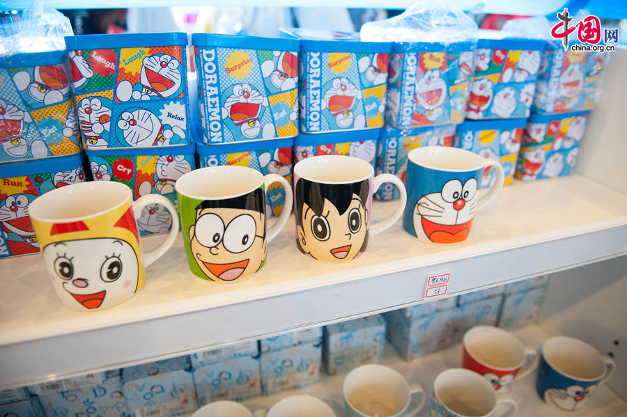 A &apos;100 Doraemon Secret Gadgets Expo&apos; is launched at Joycity Shopping Center in Beijing, on Saturday, April 19, 2014. The exhibition will last until June 22. A hundred life-size Doraemon figures, each of which bearing a distinct secret gadget, will be displayed during the show. Doraemon, a 22nd-century robotic cat, has been a popular anime character since its introduction by Japanese cartoonist Fujiko Fujio in 1969. [Photo by Chen Boyuan / China.org.cn]