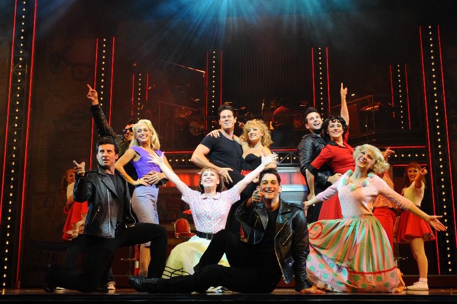 Performers perform in the musical 'Grease' during a media call in Singapore's Marina Bay Sands Theatre on April 25, 2014. The musical 'Grease' opens in the Marina Bay Sands Theatre on Friday. (Xinhua/Then Chih Wey) 