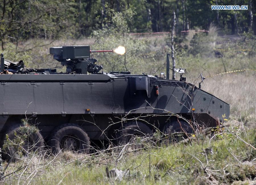 An armored fighting vehicle takes part in a joint exercise in Leopoldsburg, Belgium, on May 16, 2014.