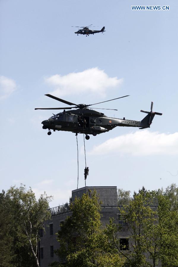 Belgian special force soldiers take part in a joint exercise in Leopoldsburg, Belgium, on May 16, 2014.