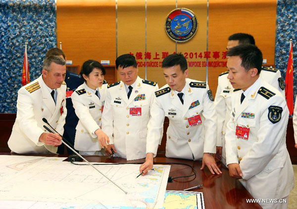 Directors of the Chinese and Russian naval forces arrange the deployment of forces in Shanghai, east China, May 20, 2014. The week-long China-Russia 'Joint Sea-2014' exercise kicked off on Tuesday. A total of 14 vessels, two submarines, nine fixed-wing aircraft as well as helicopters and special forces from both sides will take part in the exercise. 