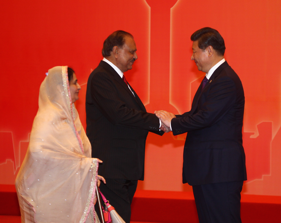 President Xi Jinping shakes hands with President of Pakistan Mamnoon Hussain on the sidelines of CICA Summit in Shanghai on May 20, 2014. [Photo: Pakistan Embassy in Beijing]