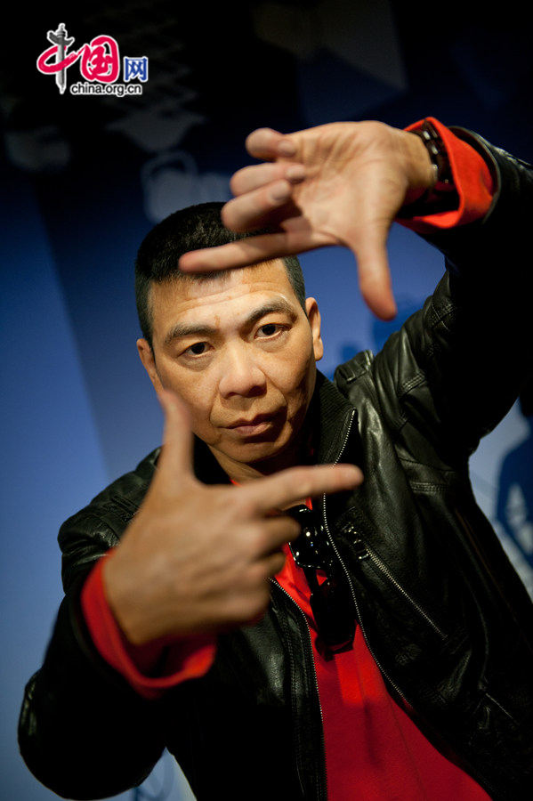 A wax figure of Feng Xiaogang is on display at Madame Tussauds Beijing on Thursday. The wax museum will be officially open to public on May 31, 2014. [Photo by Chen Boyuan / China.org.cn]