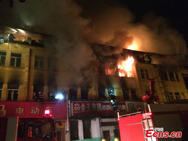 A building catches fire in Harbin, China's Heilongjiang province, Tuesday, June 10, 2014. [Photo/Ecns.cn]