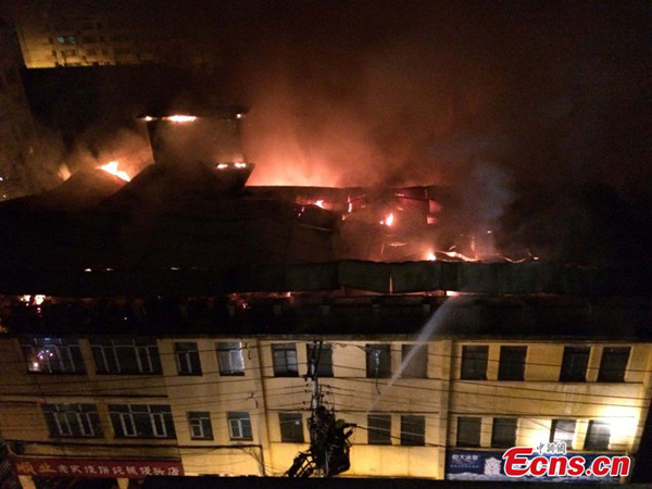 A building catches fire in Harbin, China's Heilongjiang province, Tuesday, June 10, 2014. [Photo/Ecns.cn] 