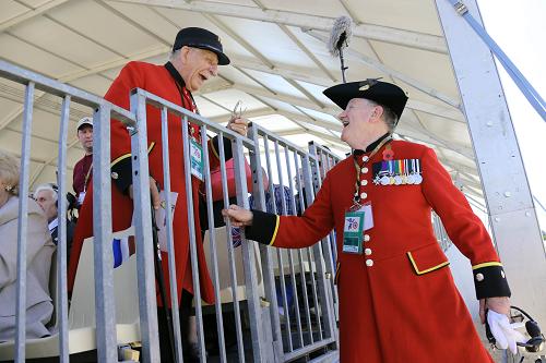 Two british veterans chat as they gather in Ouistreham before the ceremony of the D-Day commemorations, on June 6, 2014. [Xinhua photo]