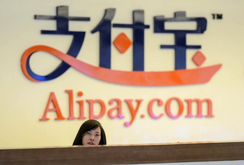 A receptionist works at Alipay's headquarters in Hangzhou, capital of East China's Zhejiang province, in this Jan 10, 2014 file photo. [Xinhua]