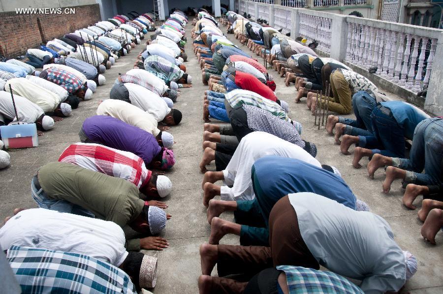 Muslims attend a mass prayer at a local mosque during Islamic holy month of Ramadan in Kathmandu, Nepal, July 4, 2014. Muslims around the world refrain from eating, drinking and smoking from dawn to dusk during the fasting month of Ramadan. 