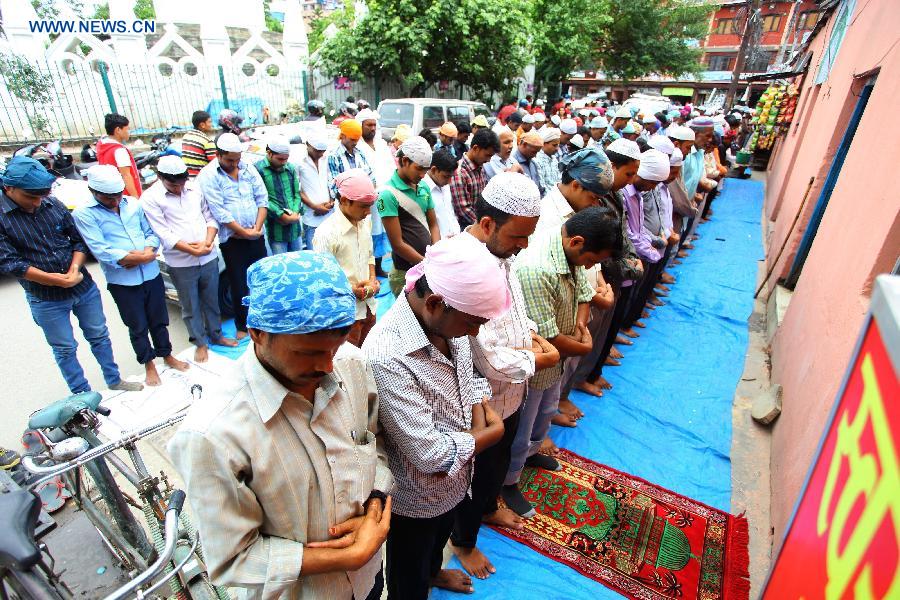 Muslim devotees offer their prayers on the first Friday of the holy month of Ramadan in front of a local mosque in Kathmandu, Nepal, on July 4, 2014. Ramadan is the Islamic month when Muslims abstain from food, drink, and other physical needs during the daylight hours.