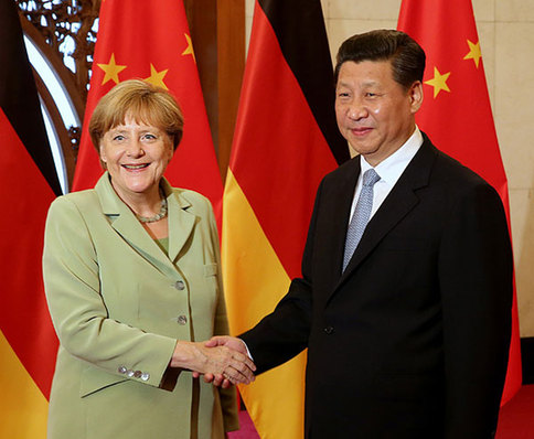 President Xi Jinping meets German Chancellor Angela Merkel at the Diaoyutai State Guesthouse in Beijing on Monday. [China Daily] 