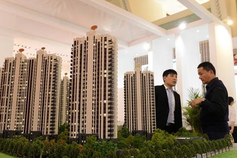 A visitor to a housing exhibition in Shanghai in April inquires about a property project. The IMF's new global house price index showed that 33 out of 52 countries, including China, experienced increases in housing prices over the past year. [China Daily]