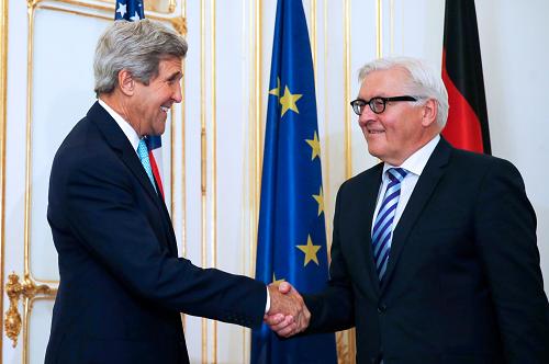 US Secretary of State John Kerry (L) shakes hand with German Foreign Minister Frank-Walter Steinmeier before a bilateral meeting, as part as talks between the foreign ministers of the six powers negotiating with Tehran on its nuclear program, in Vienna, on July 13, 2014. [Xinhua photo]