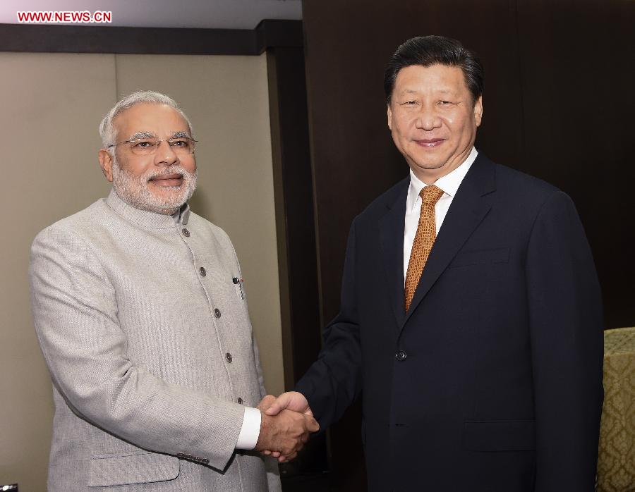 Chinese President Xi Jinping(R) meets with Indian Prime Minister Narendra Modi in Fortaleza, Brazil, July 14, 2014. [Photo/Xinhua]