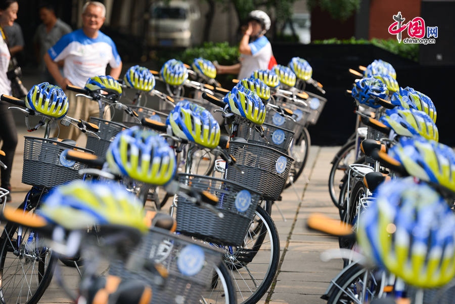 Some 30 tailor-made Giant bikes are parked at the United Nations China HQ compound on Friday, July 18, 2014, as the UN teams up with China Bicycle Association (CBA) and other partners to promote an environmentally-friendly transport mode with a cycling event around the Sanlitun area in Beijing. [Photo by Chen Boyuan / China.org.cn]