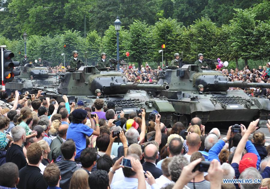 Tanks attend the National Day millitary parade in Brussels, Belgium, on July 21, 2014. [Photo/Xinhua]
