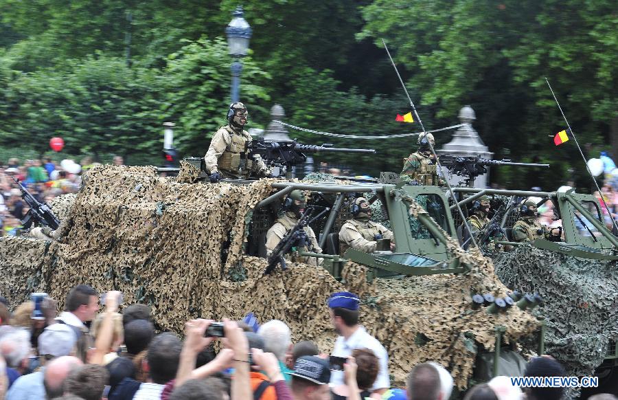 Armed vehicles attend the National Day millitary parade in Brussels, Belgium, on July 21, 2014. [Photo/Xinhua]