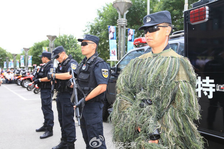 Four vice ministers of public security--Yang Huanning, Chen Zhimin, Fu Zhenghua and Li Wei--distributed anti-terrorism brochures to the public at a shopping mall in Beijing's Xicheng District on July 22, 2014.