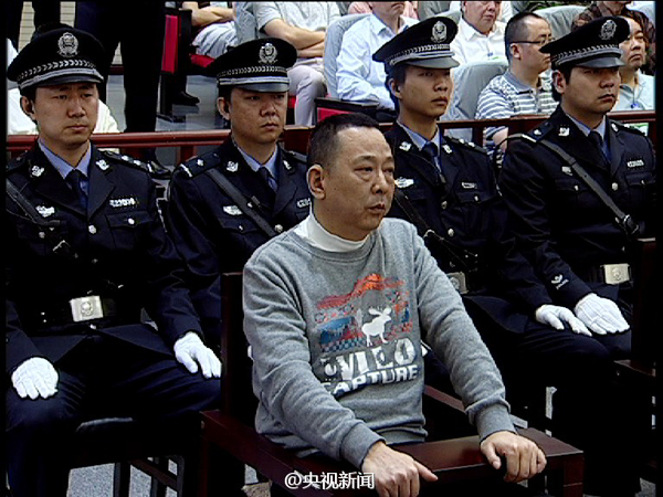 Former mining tycoon Liu Han sits in a Chinese court in central China's Hubei Province on May 23, 2014. [Photo/CCTV]