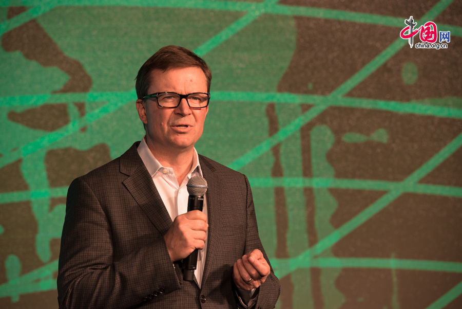 Ned Desmond, COO of TechCrunch, delivers a keynote speech at the opening ceremony of TechCrunch 2014 held in Beijing on Monday, Aug. 11. The TechCrunch 2014 will last two days during which science and technology companies will showcase their latest products as well as solutions. [Photo by Chen Boyuan / China.org.cn]