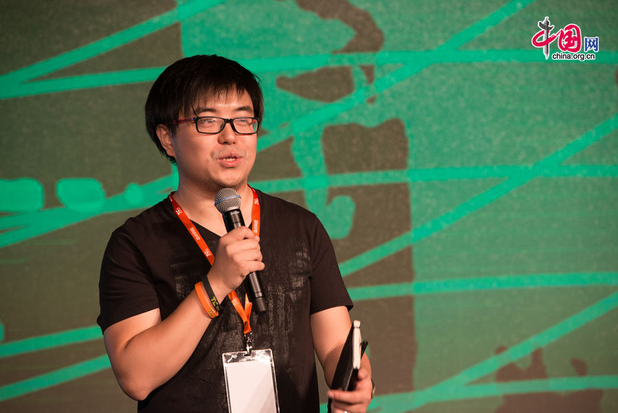 Lu Gang, founder of TechNode, delivers a keynote speech at the opening ceremony of TechCrunch 2014 held in Beijing on Monday, Aug. 11. The TechCrunch 2014 will last two days during which science and technology companies will showcase their latest products as well as solutions. [Photo by Chen Boyuan / China.org.cn]