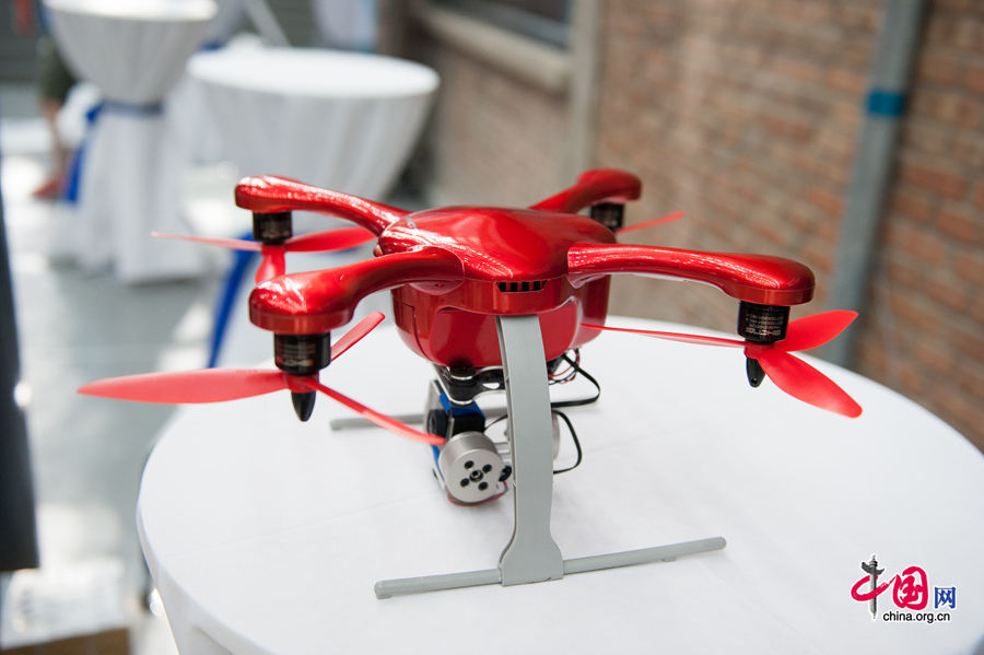 A radio controlled hovering drone is on display at the TechCrunch 2014 on Monday, Aug. 11, 2014 in Beijing. The TechCrunch 2014 will last two days during which science and technology companies will showcase their latest products as well as solutions. [Photo by Chen Boyuan / China.org.cn]