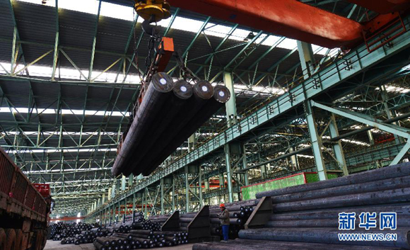 A steel production line in Zouping County of Binzhou City, Shandong Province. China's industrial value-added output expanded 9 percent year on year in July 2014. [File photo/Xinhua] 