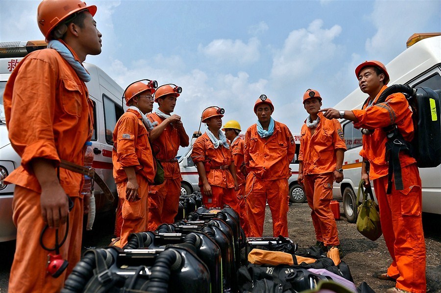 Rescuers get ready to enter a coal mine where 27 men were trapped underground after an explosion yesterday. Two bodies have been retrieved while another 25 people remain missing in the coal mine in east China's Anhui Province, the rescue headquarters said today.