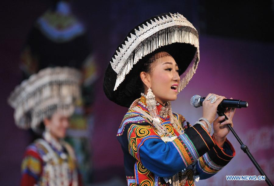 A woman of the Yi ethnic group performs during a talent show of a traditional beauty contest at Xichang City, southwest China's Sichuan Province, July 23, 2014. The beauty contest is one of the most important activities during the annual Torch Festival at Liangshan Yi Autonomous Prefecture. It can date back to over 1,000 years ago in the history of the Yi ethnic group. (Xinhua/Xue Yubin) 
