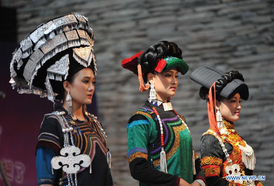 Women of the Yi ethnic group present their folk costumes during a traditional beauty contest at Xichang City, southwest China's Sichuan Province, July 23, 2014. The beauty contest is one of the most important activities during the annual Torch Festival at Liangshan Yi Autonomous Prefecture. It can date back to over 1,000 years ago in the history of the Yi ethnic group. (Xinhua/Xue Yubin) 