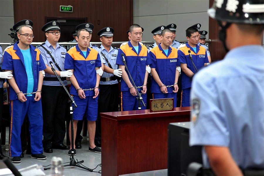 Five of the seven men charged with a fatal arson attack stand trial yesterday in Qingdao, Shandong Province. One man died and three others were injured when the tent in which they were sleeping was set on fire. All four were protesting against a property development in their village. 