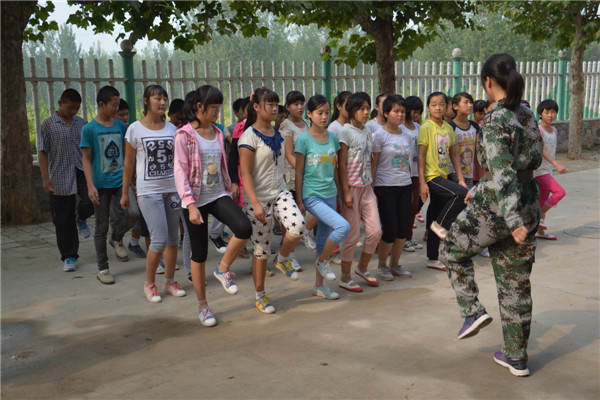 Students receive a military training exercise in Mengyin, East China's Shandong province. [Provided to chinadaily.com.cn]