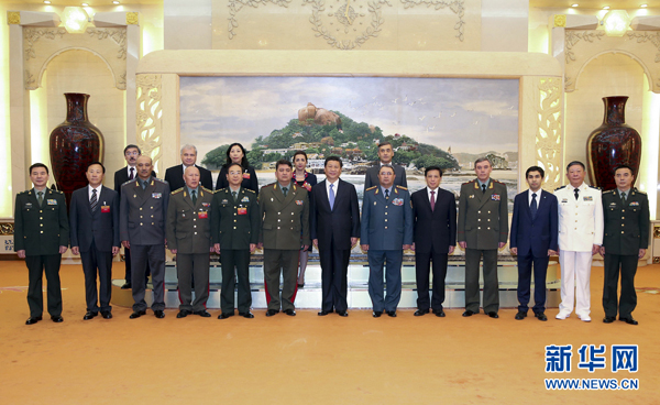 Chinese President Xi Jinping (C, front) poses for a group photo with chiefs of general staff of Shanghai Cooperation Organization (SCO) members in Beijing, capital of China, Aug. 28, 2014.