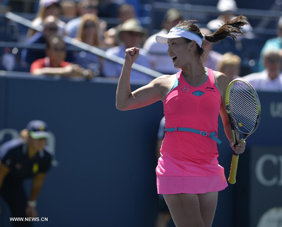Peng Shuai of China jubilates after the third round match of women's singles against Roberta Vinci of Italy at the 2014 U.S. Open in New York, the United States, Aug. 29, 2014. Peng won the match 3-0. 