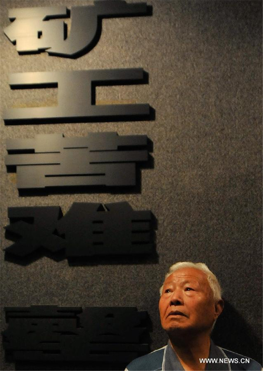 Liu Qixiang, a surviving forced miner who worked for Japan during the World War II, recalls the past at a museum of Liaoyuan miners' tomb during Japanese occupation in Liaoyuan, Northeast China's Jilin province, Aug 28, 2014.