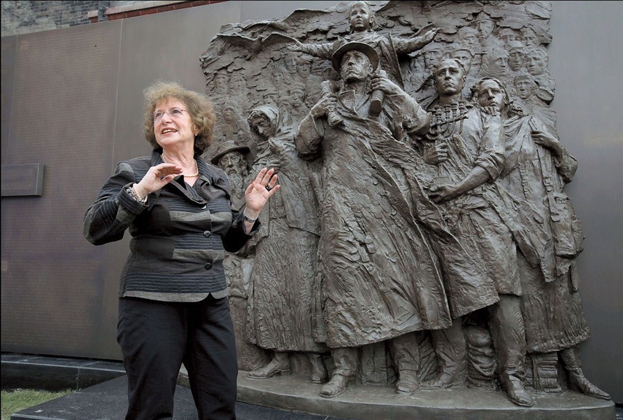 Wartime refugee Sonja Muhlberger, 75, stands in front of the statue of six Jewish people that was unveiled at the Shanghai Jewish Refugees Museum yesterday. — Wang Rongjiang