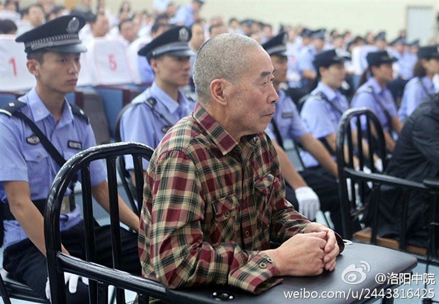 Hu Wanlin sits during his trial yesterday at the Luoyang Intermediate People’s Court in Henan Province.